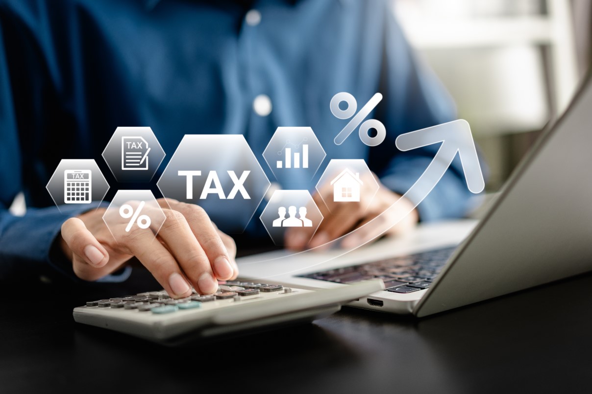 E-Filing, Taxpayer using a laptop to file taxes personal income, Tax Return form online for tax payment